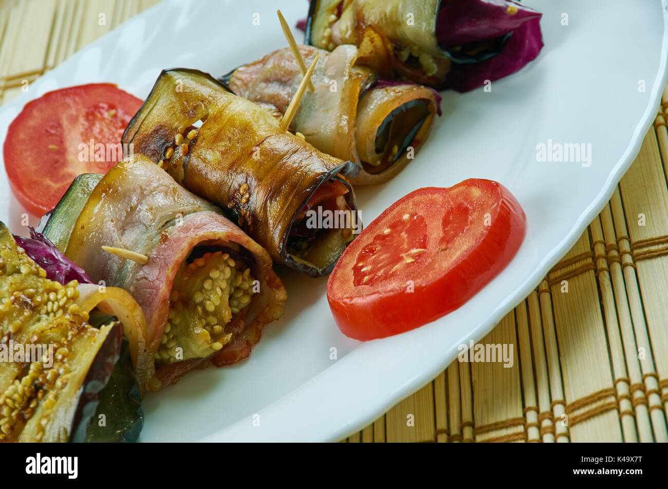 Italian Eggplant wraps with prosciutto and mozzarella Stock Photo - Alamy