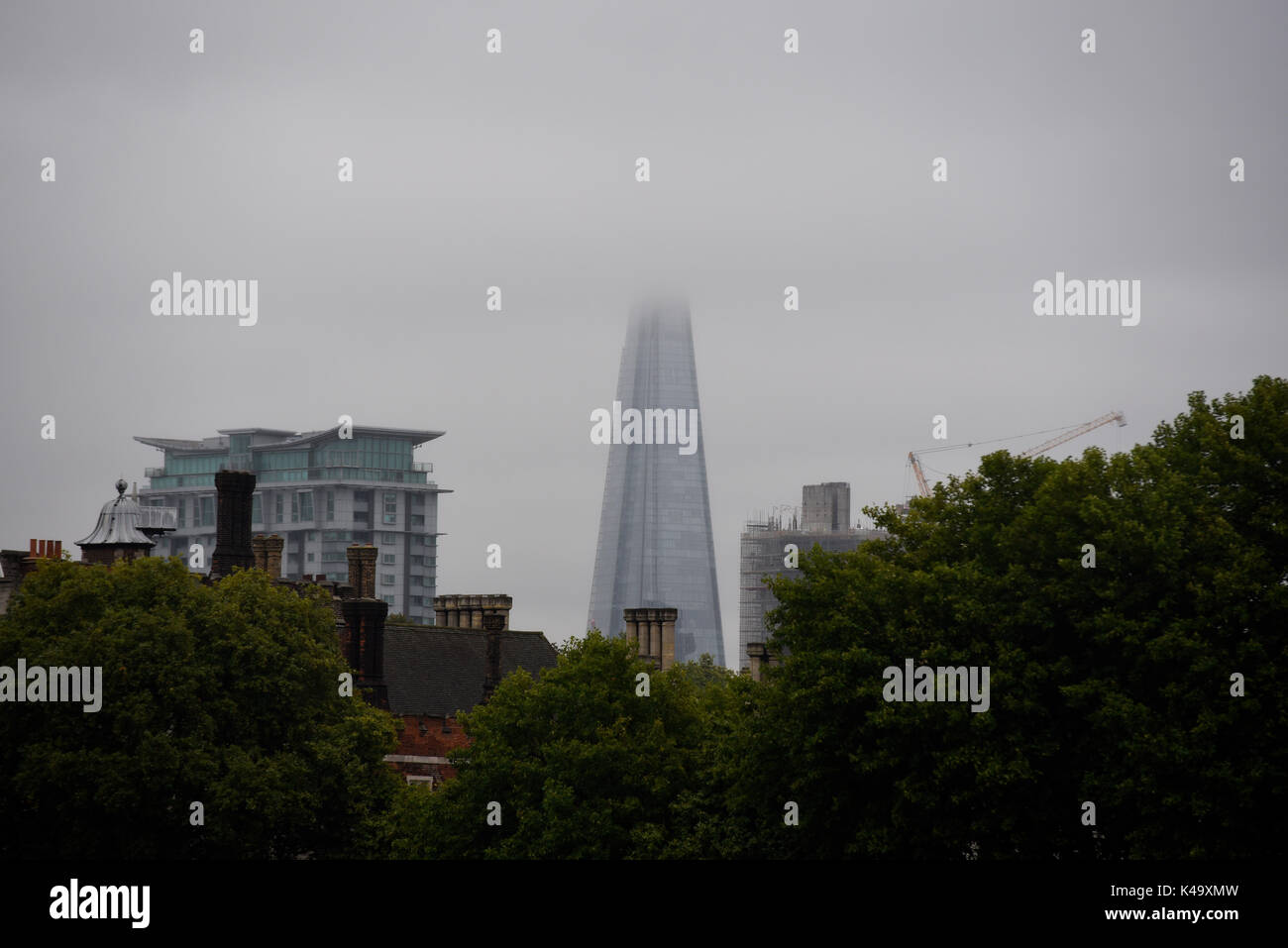 The Shard in dull weather in London England with the top hidden in cloud Stock Photo