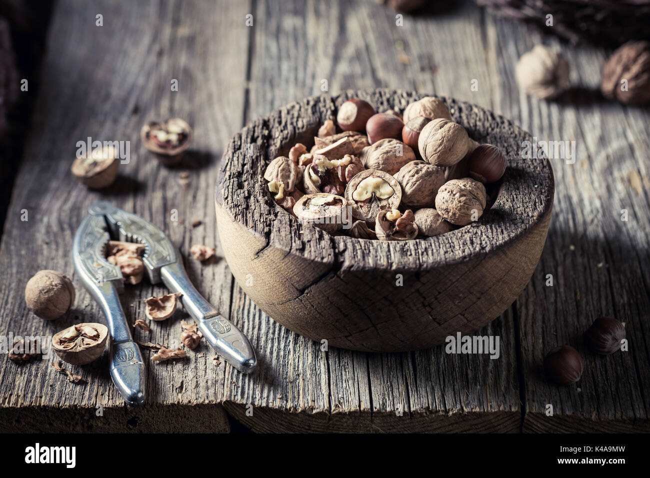 Healthy various nuts with with old nutcracker Stock Photo