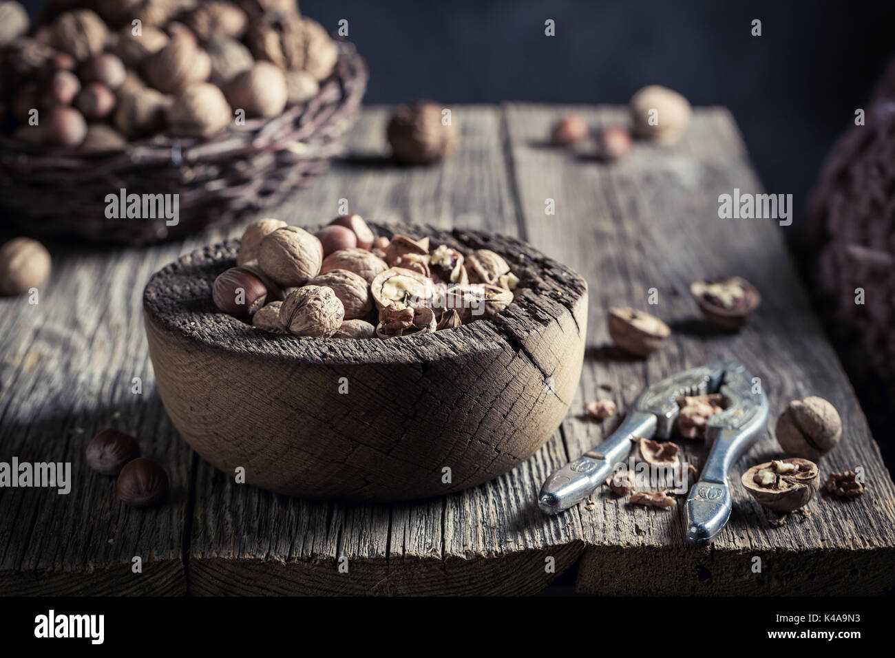 Delicious various nuts with with old nutcracker Stock Photo