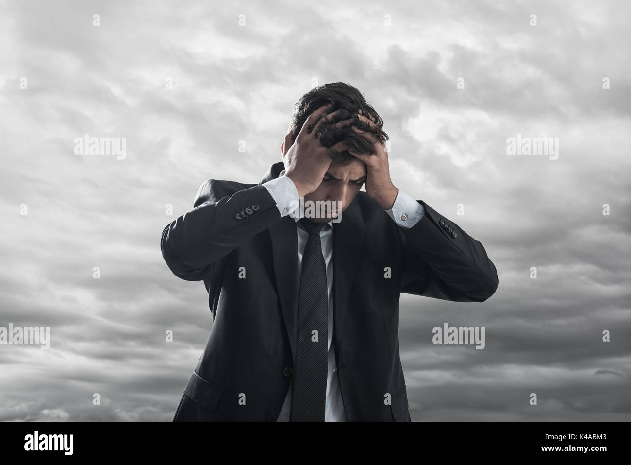Bankrupted businessman with depressed look on his face Stock Photo