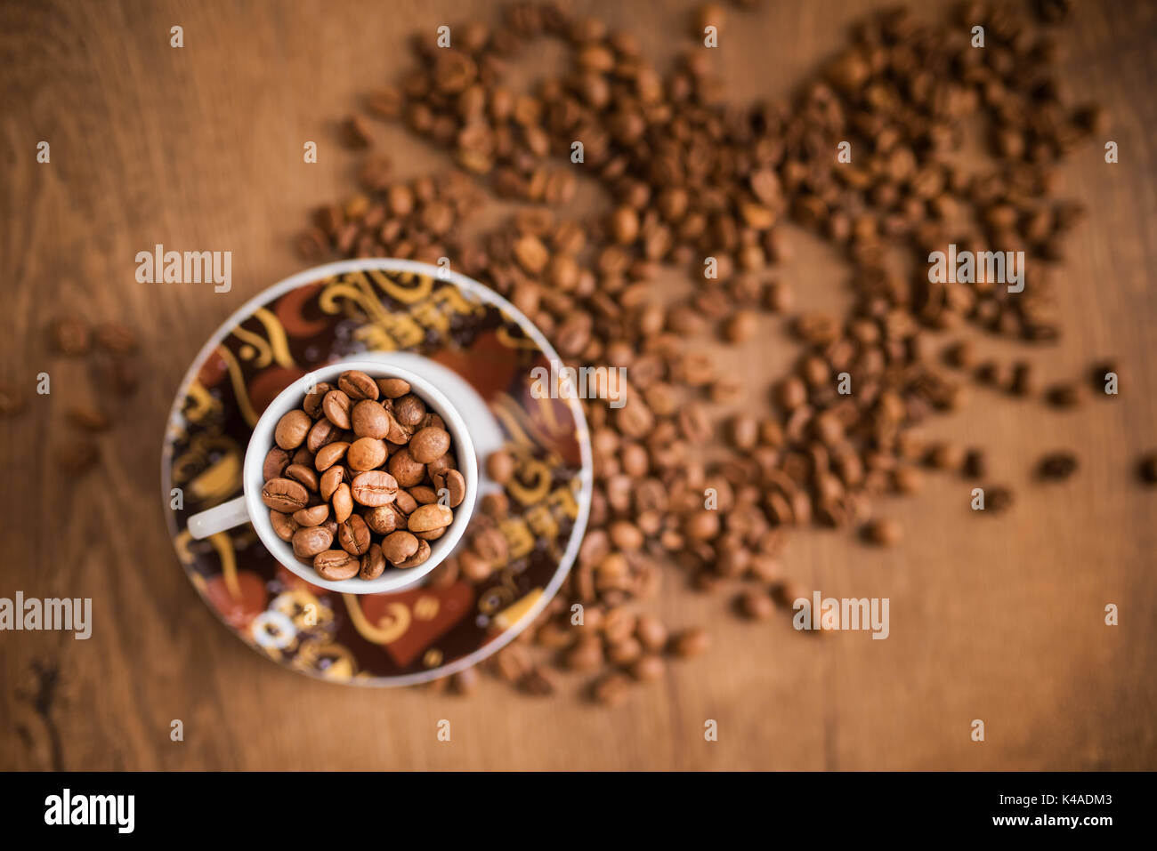 coffee cup and coffee beans on wooden table Stock Photo