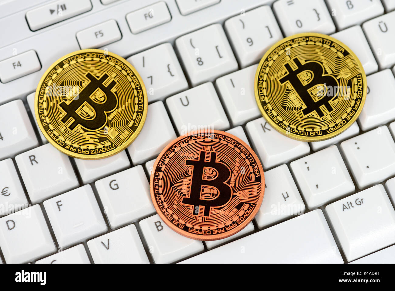 Bitcoins On Computer Keyboard, Virtual Currency Stock Photo
