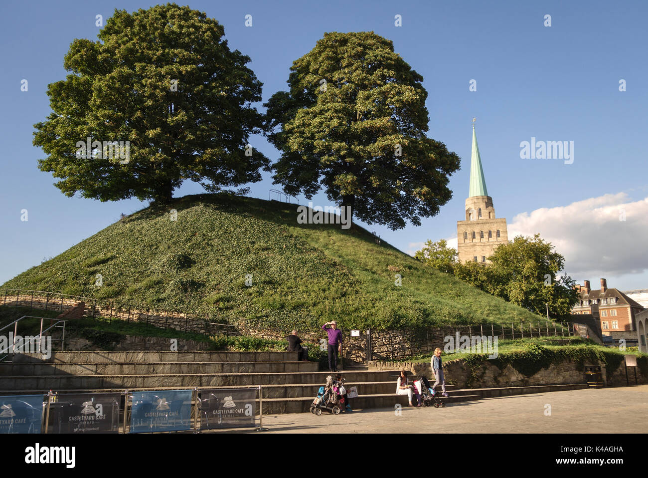 Oxford, UK. The 11c Castle Mound (motte) with the tower of Nuffield College in the background Stock Photo
