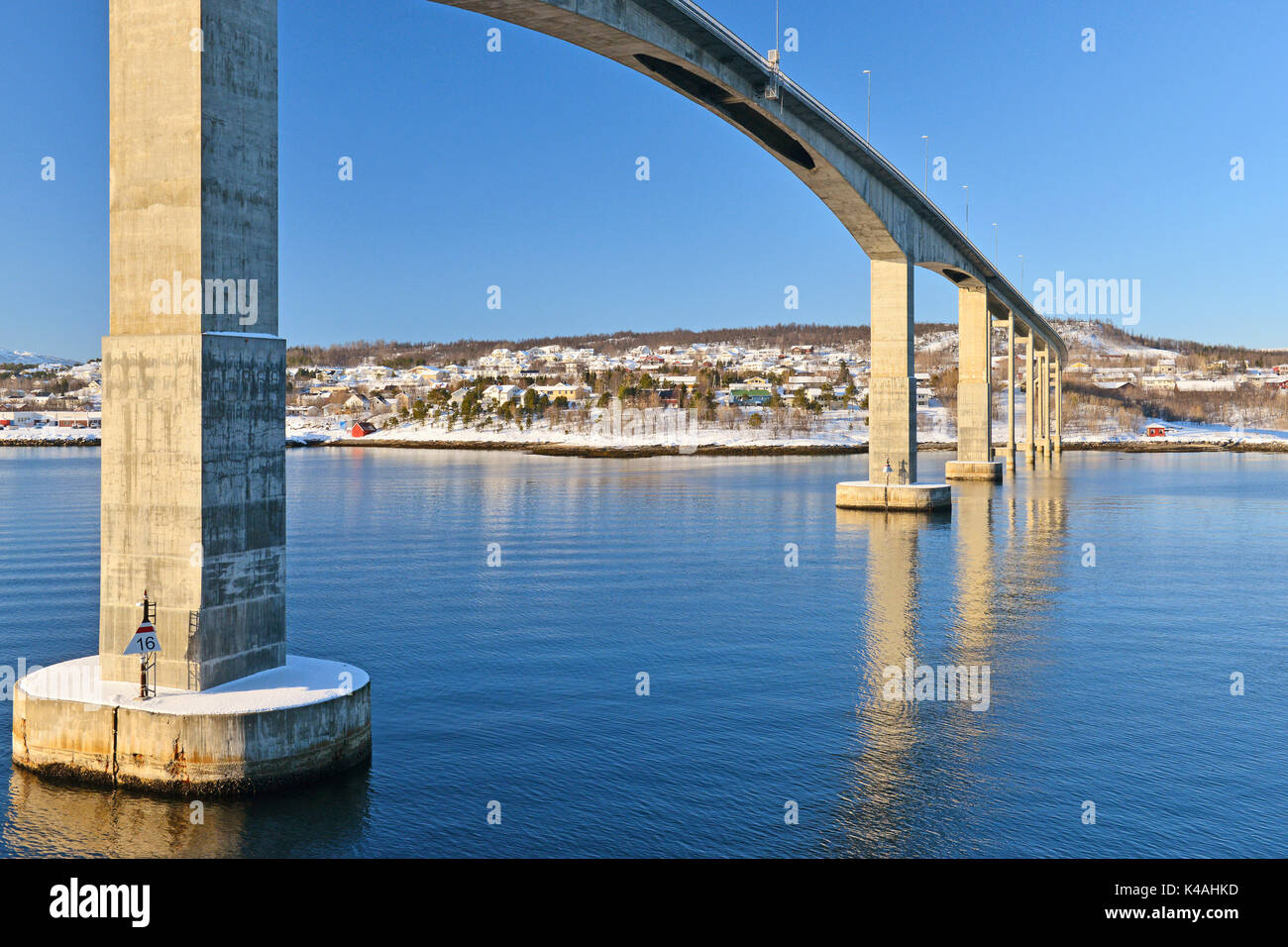 Bridge made of concrete is reflected in Gisund, near Finnsnes, Troms, Norway Stock Photo