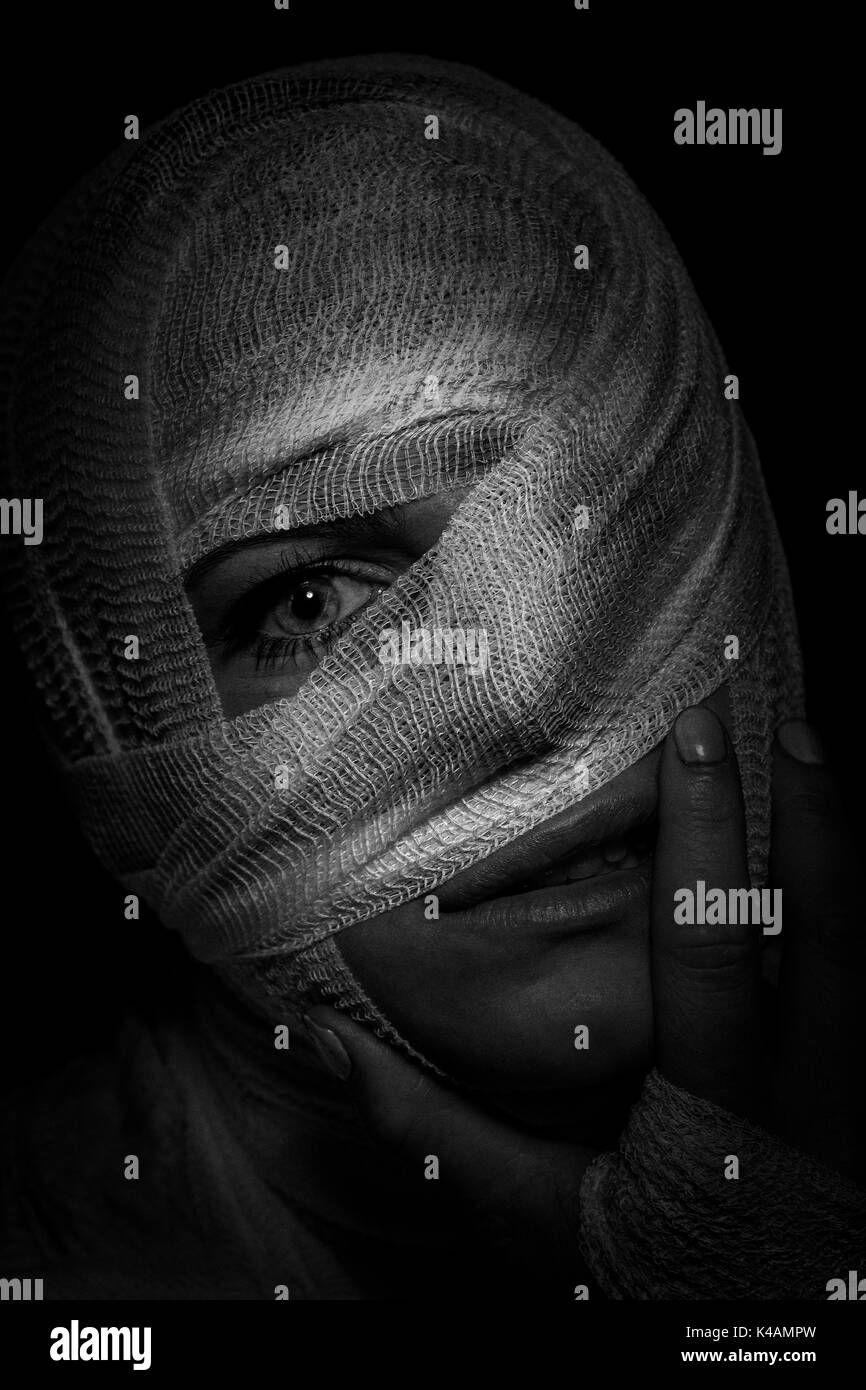 Young Traumatized Woman Wearing A Head Bandage For The Purpose Of Injury Stock Photo