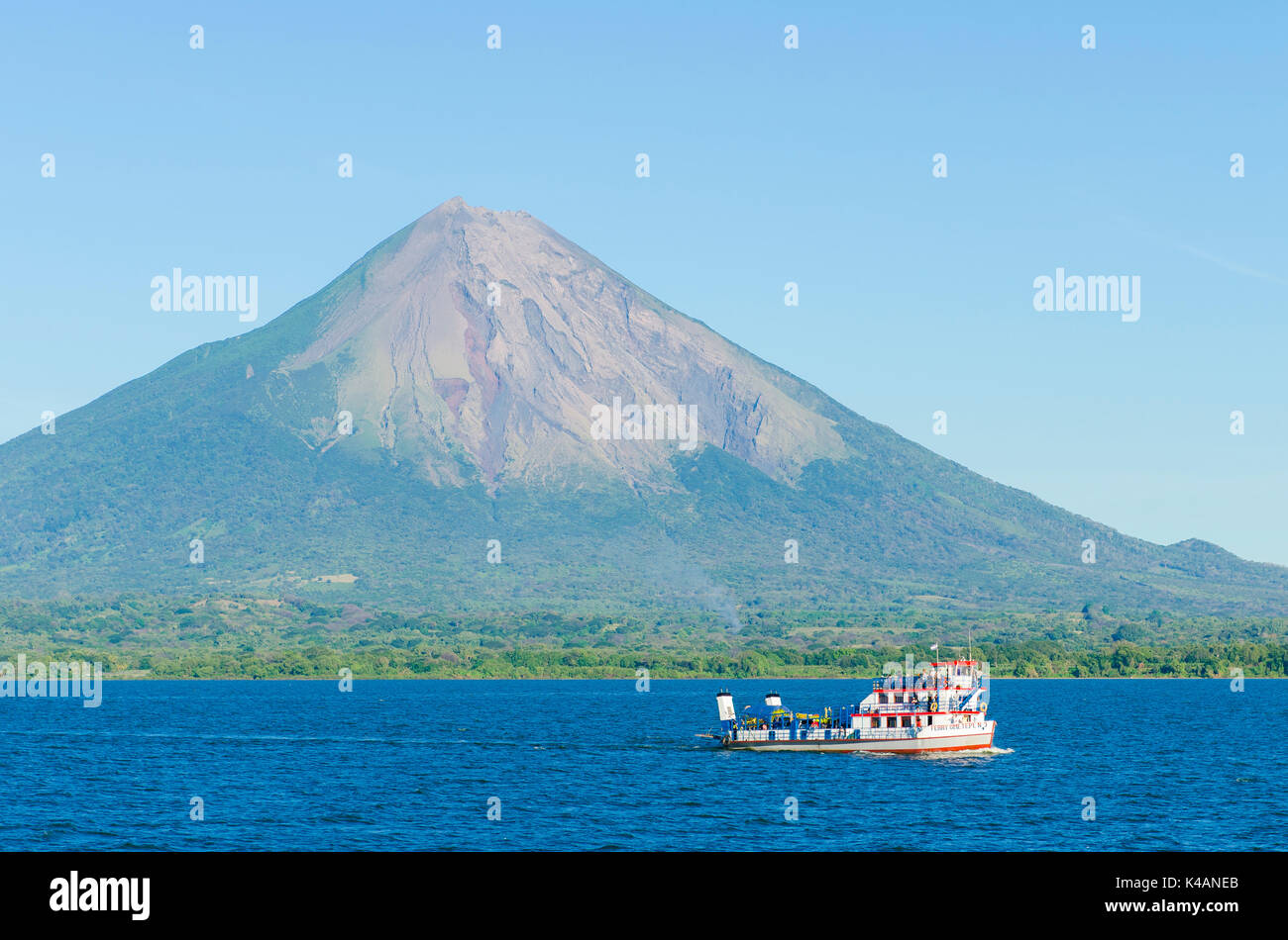 Ferry in front of the island of Ometepe with the volcano Concepcion, Nicaragua Lake (Lago Cocibolca), Nicaragua Stock Photo