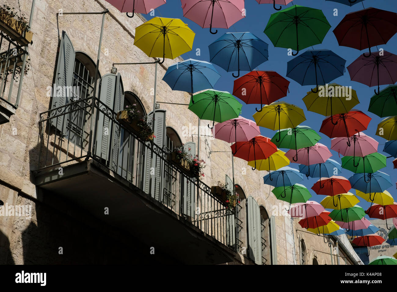 Colorful umbrellas are suspended above Nahalat Shiva alley a pedestrian