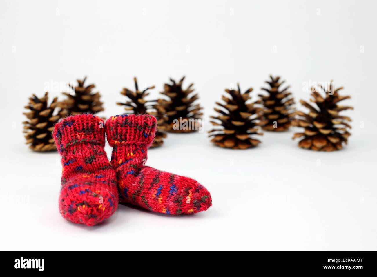Pine Cones With Woolen Socks Stock Photo