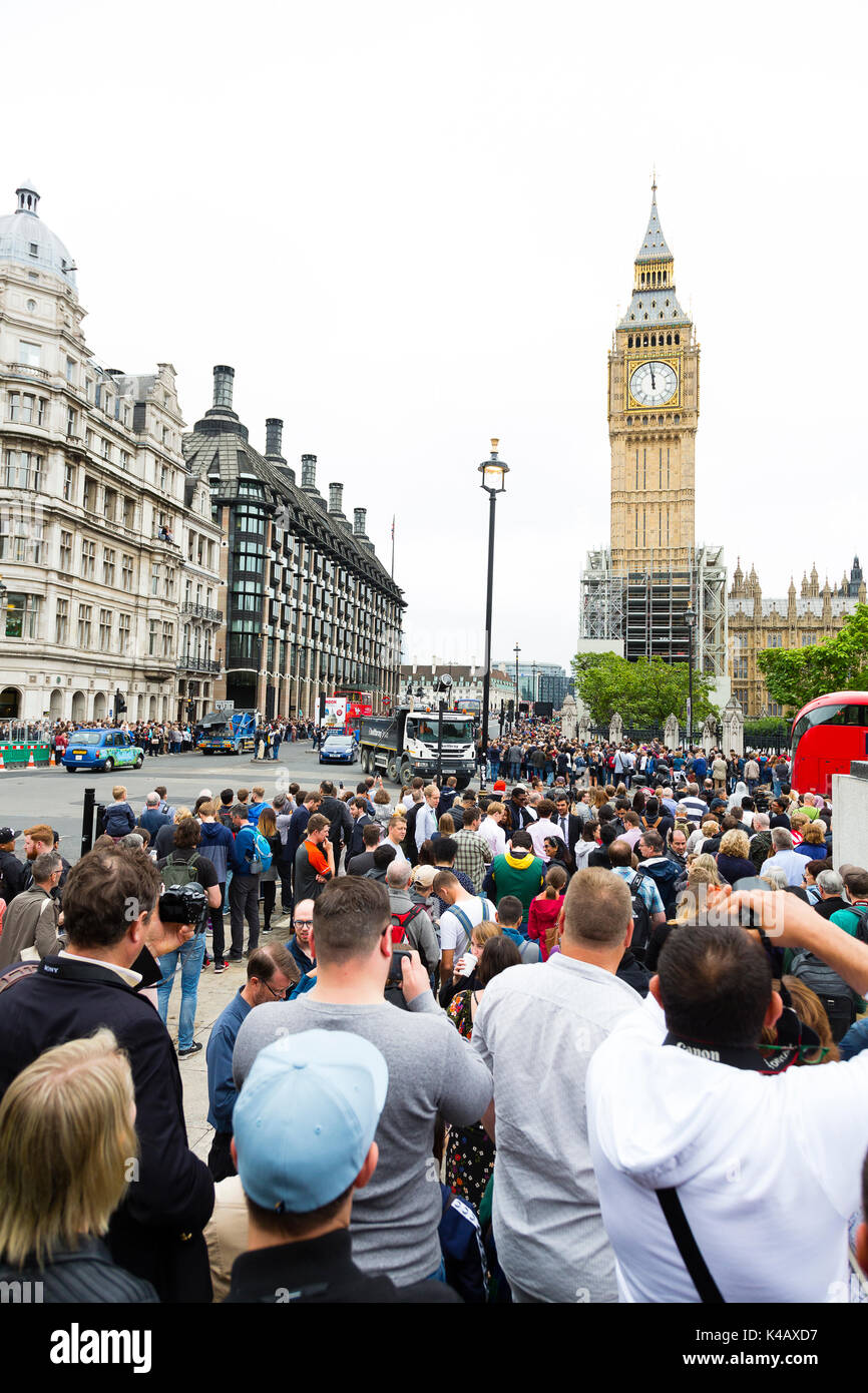 London, UK. Crowds gather to watch and listen to Big Ben fall silent. Stock Photo