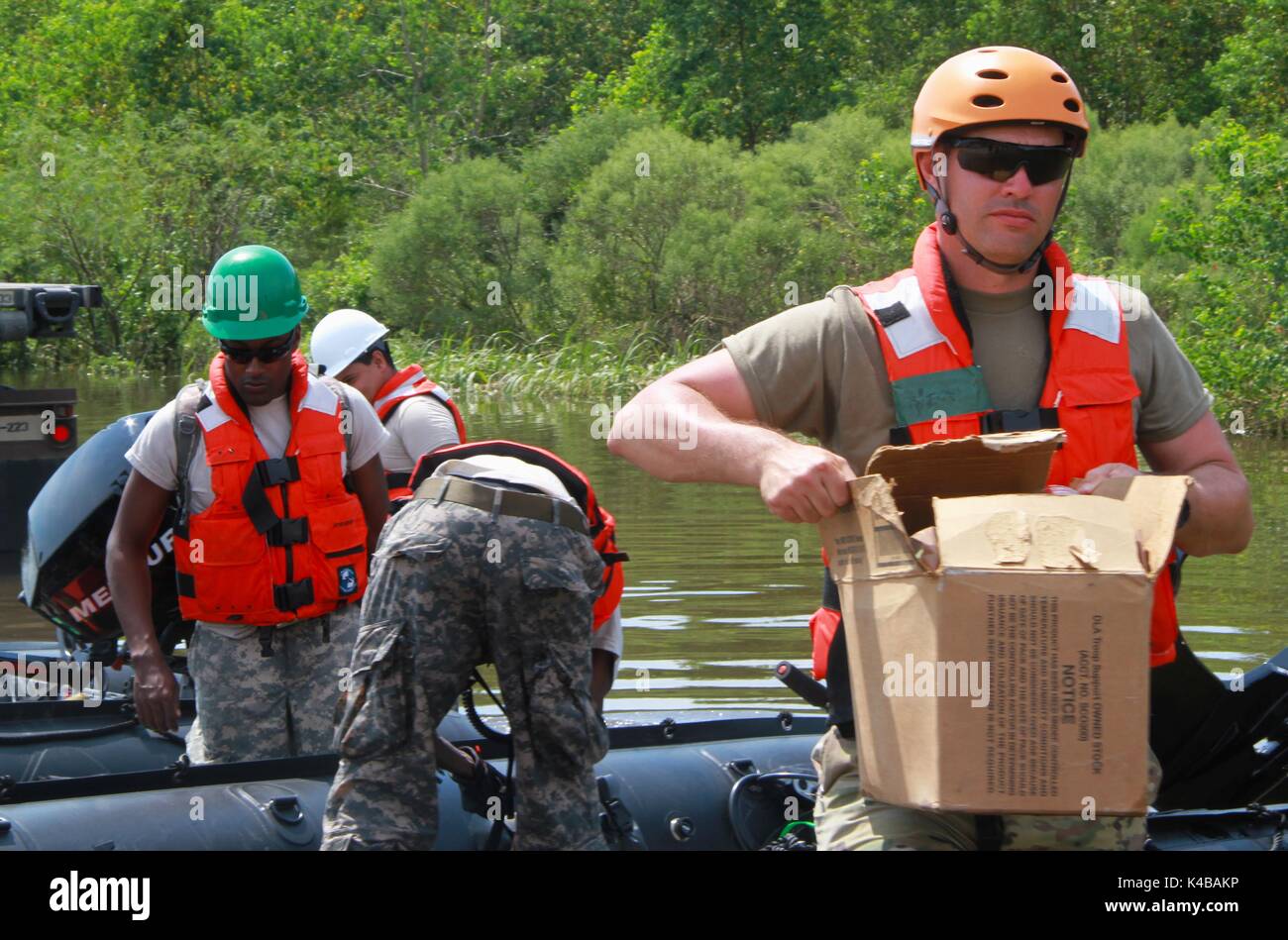 U.S Army 1st Lt. Joshua Wiegand off-loads a box of Meals, Ready-to-Eat for delivery to residents in the aftermath of Hurricane Harvey September 3, 2017 in Beaumont, Texas. Stock Photo
