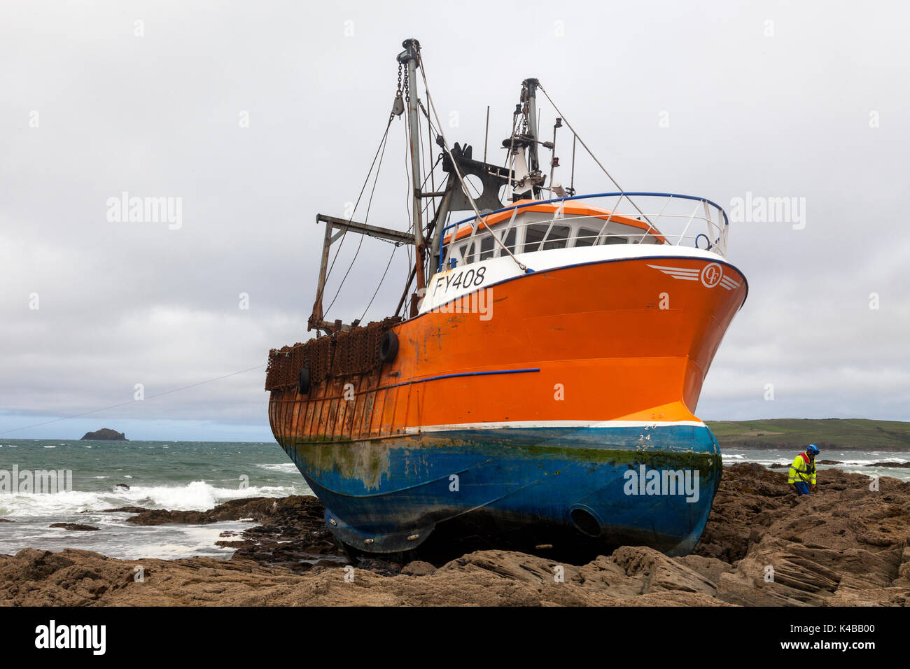 Greenaway Beach, Trebetherick, Cornwall, U.K. 5th September 2017. HM Coastguard watch over a stricken fishing trawler. The Cornish registered Le Men Du, reported to be worth £1M (GBP) ran aground on Tuesday morning. The vessel was re-floated at high tide Tuesday evening. Credit: Mark Richardson/Alamy Live News Stock Photo