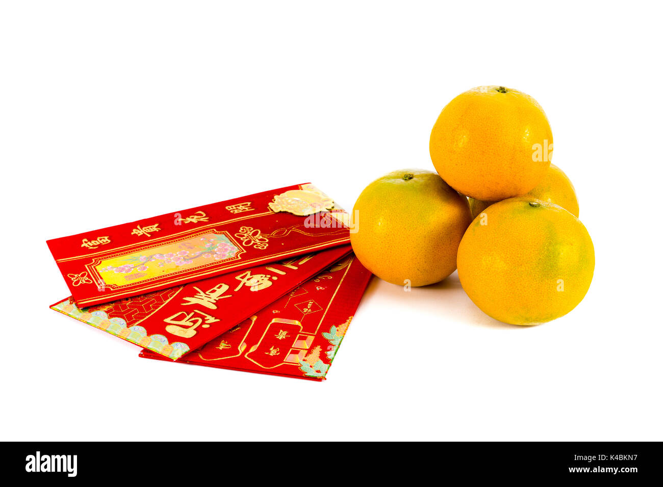 Four oranges and red envelope with chinese blessing word are gift for