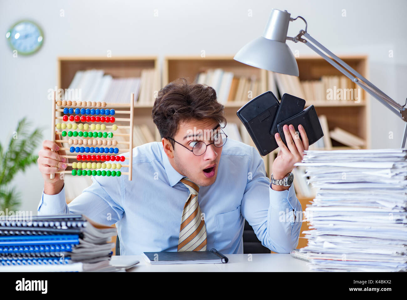 Funny accountant bookkeeper working in the office Stock Photo - Alamy