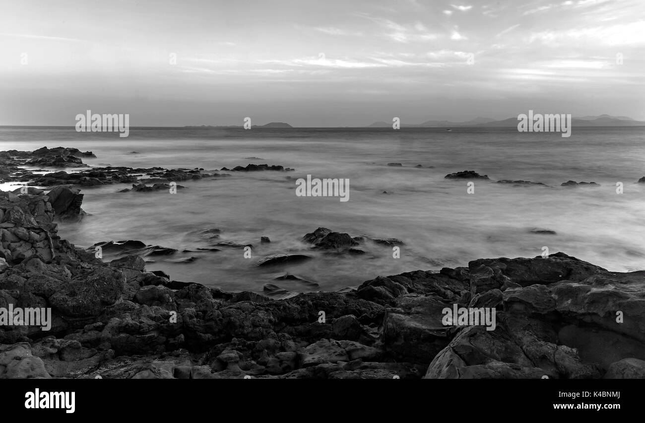 Rocky Coast At Punta Pechiguera Near Playa Blanca, Monochrome, Long Exposure, Lanzarote, Canary Islands, Spain, Europe Stock Photo