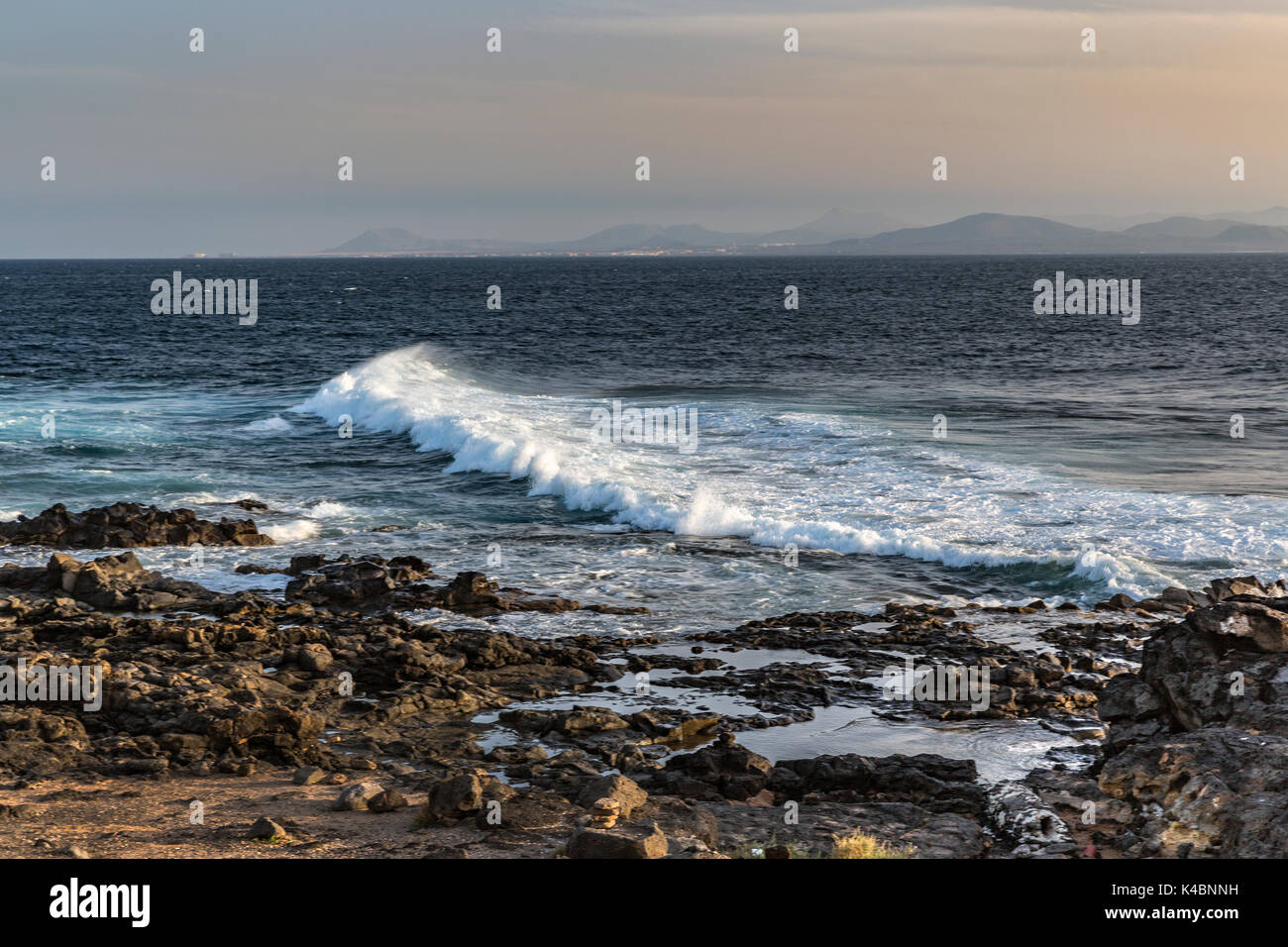 Waves On The Cliff At Punta Pechiguera Near Playa Blanca For Sunset, Long Exposure, Lanzarotes, Canaries, Spain, Europe Stock Photo