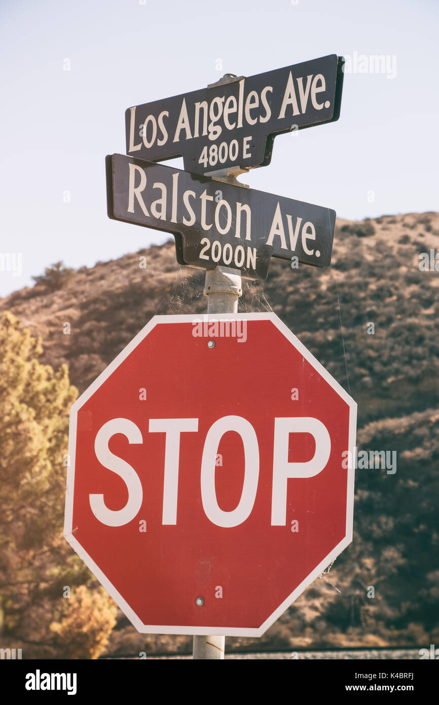 Street signs for Los Angeles Avenue and Ralston Avenue and stop sign in Simi Valley, California. Stock Photo