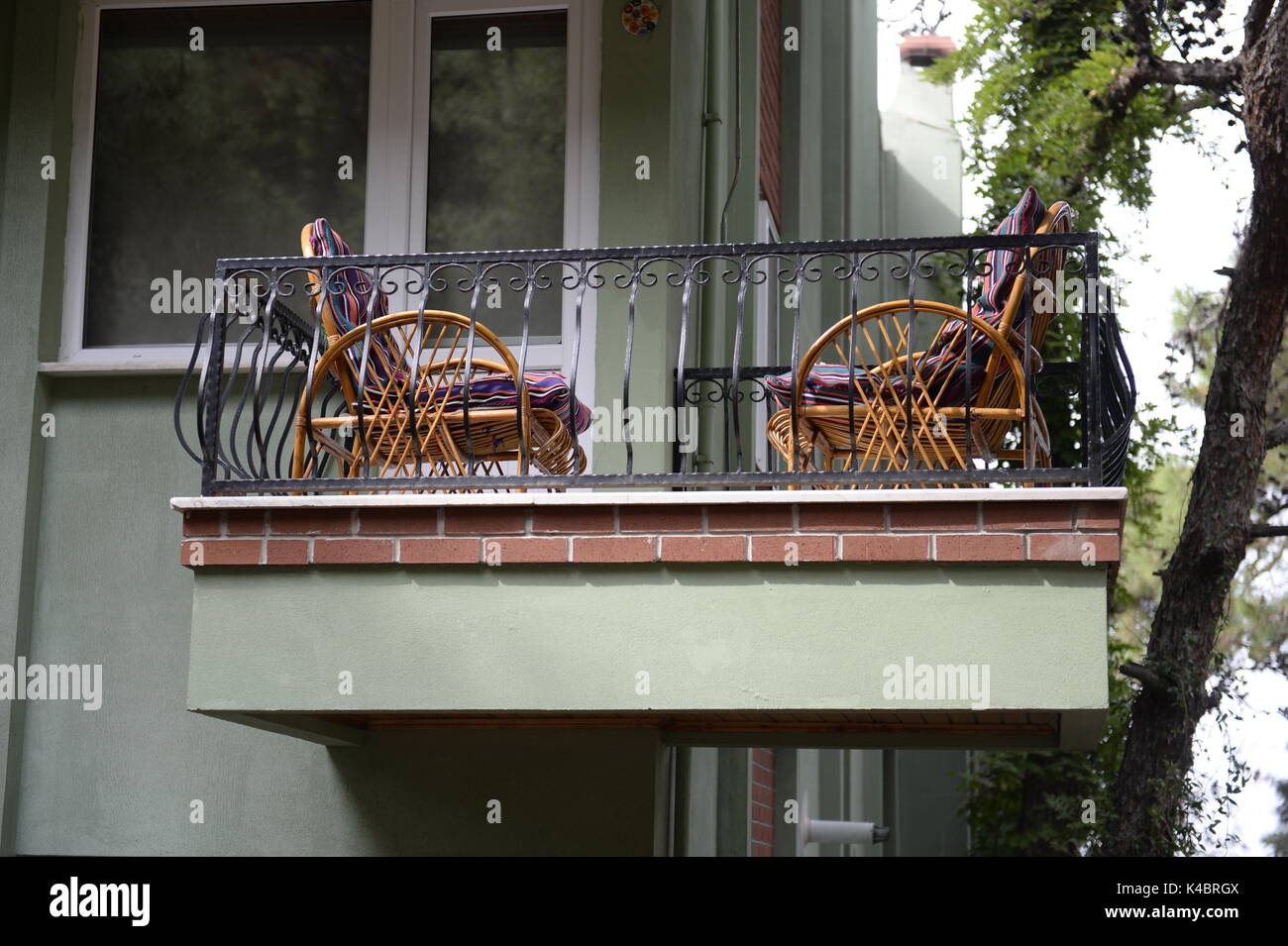 Two Wicker Chairs On A Balcony Stock Photo - Alamy