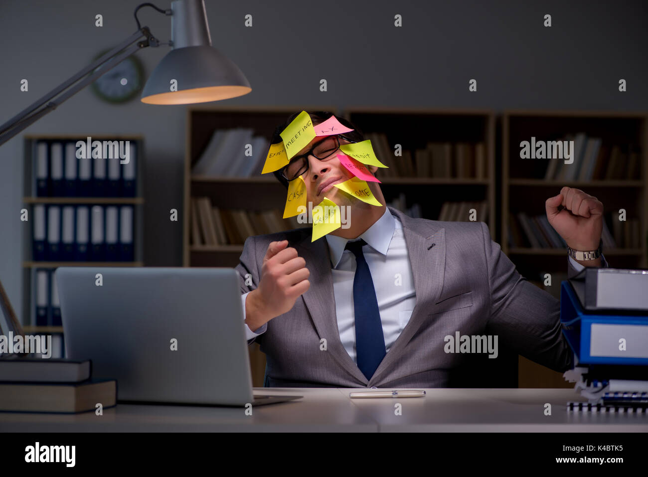 To Sort Out Businessman staying late to sort out priorities Stock Photo - Alamy