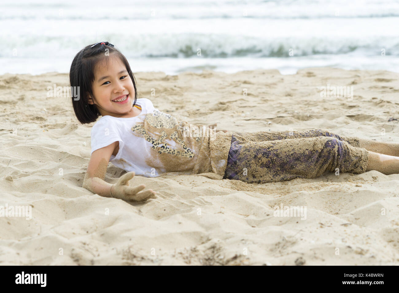 child 6s girl enjoy play beach Stock Photo