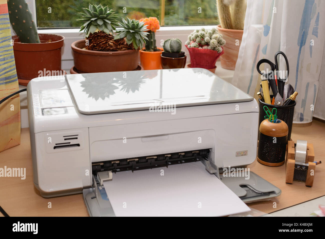 Inkjet Printers And Other Accessories Are At The Desk In An Office Stock Photo