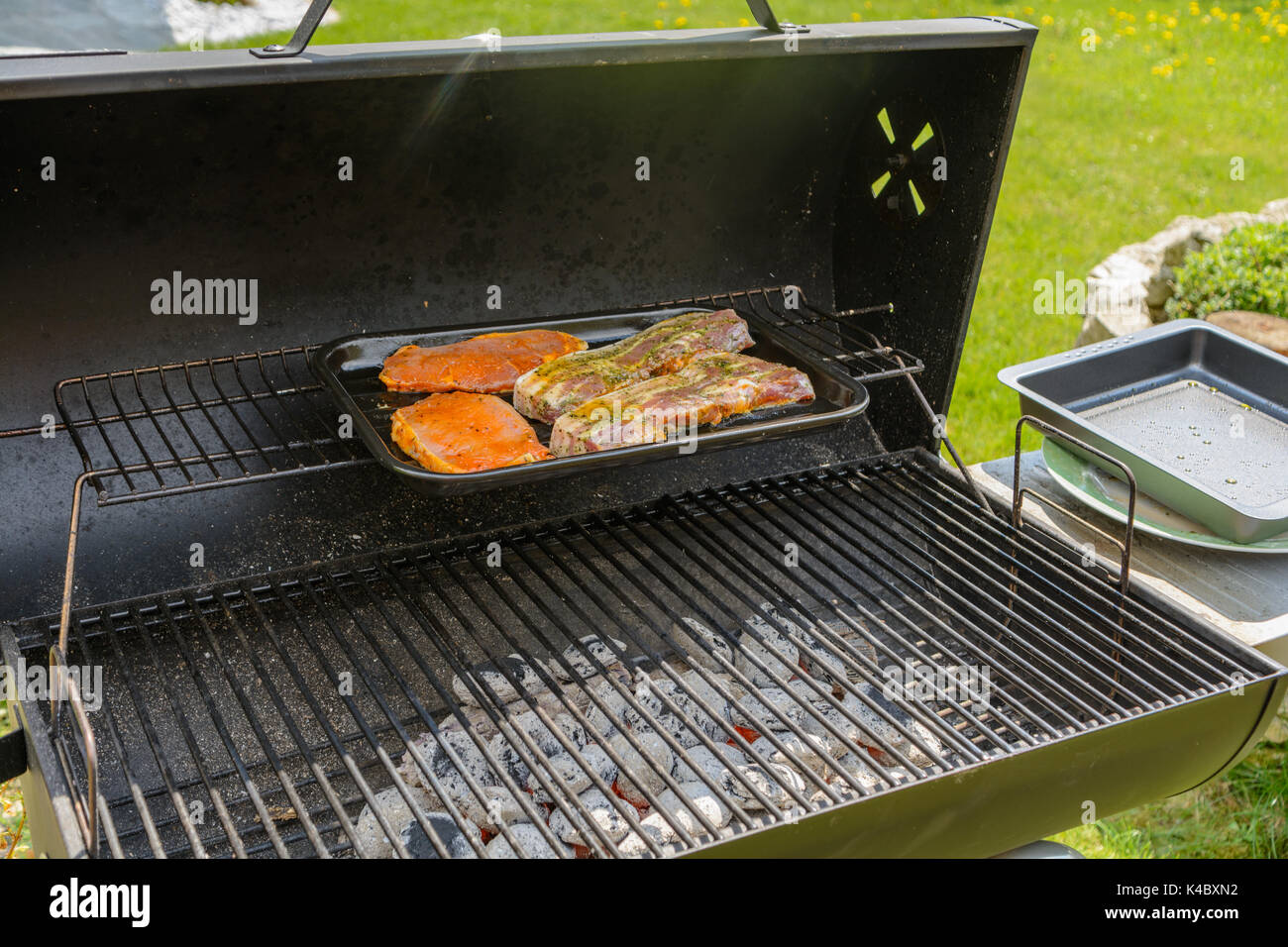 Deliciously Seasoned Meat Is Grilled At The Charcoal Grill Stock Photo