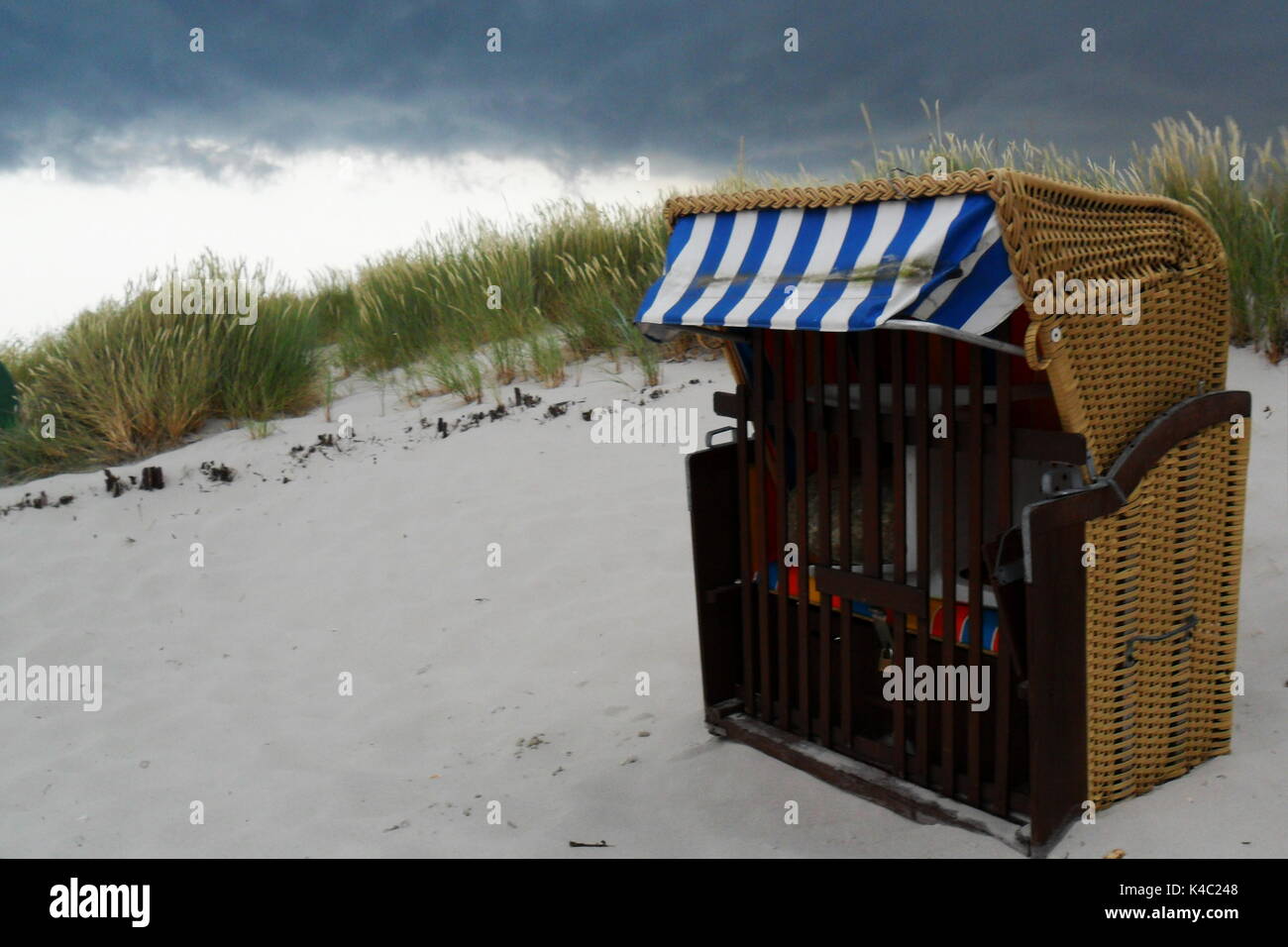 Strandkorb/beach chair on Usedom, Baltic Sea in front of sand dune Stock Photo