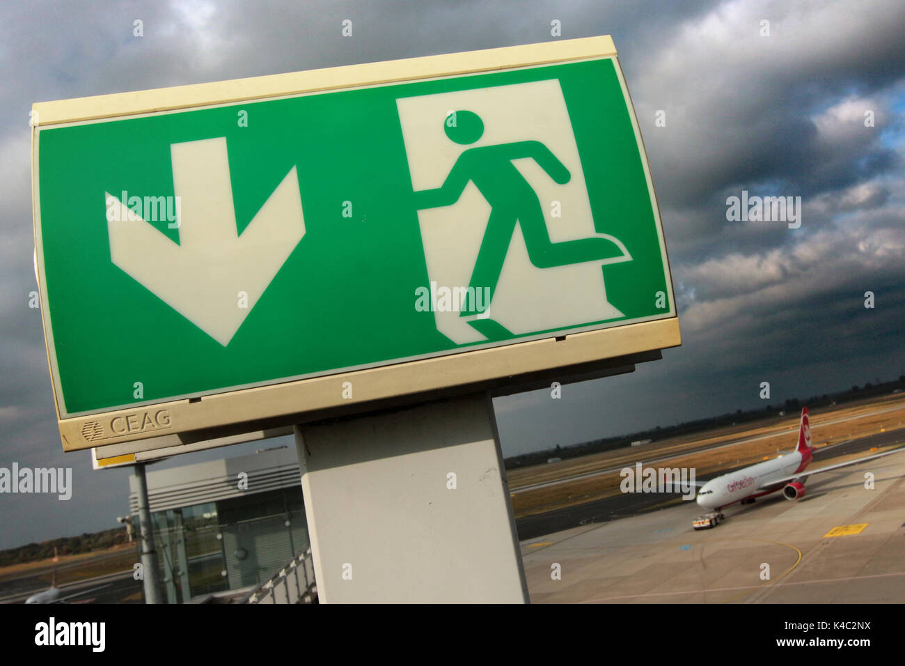 Emergency Exit Sign With Airbus A320 Of Airberlin At Duesseldorf Airport Stock Photo