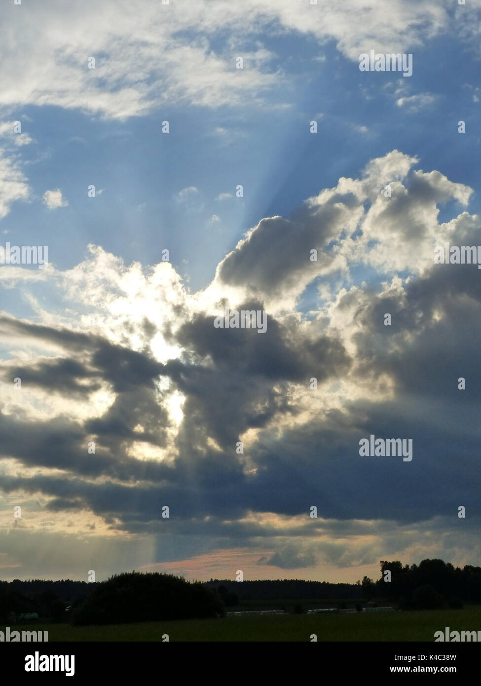 The sun shines behind the cloud hi-res stock photography and images - Alamy