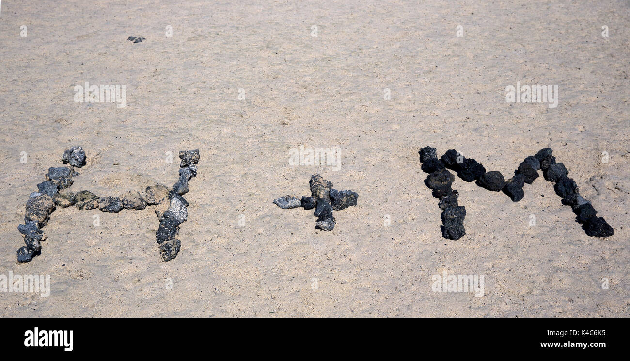 Letter From Black Lava Stones At The Sand Beach, Lanzarote, Canary Islands, Spain Stock Photo
