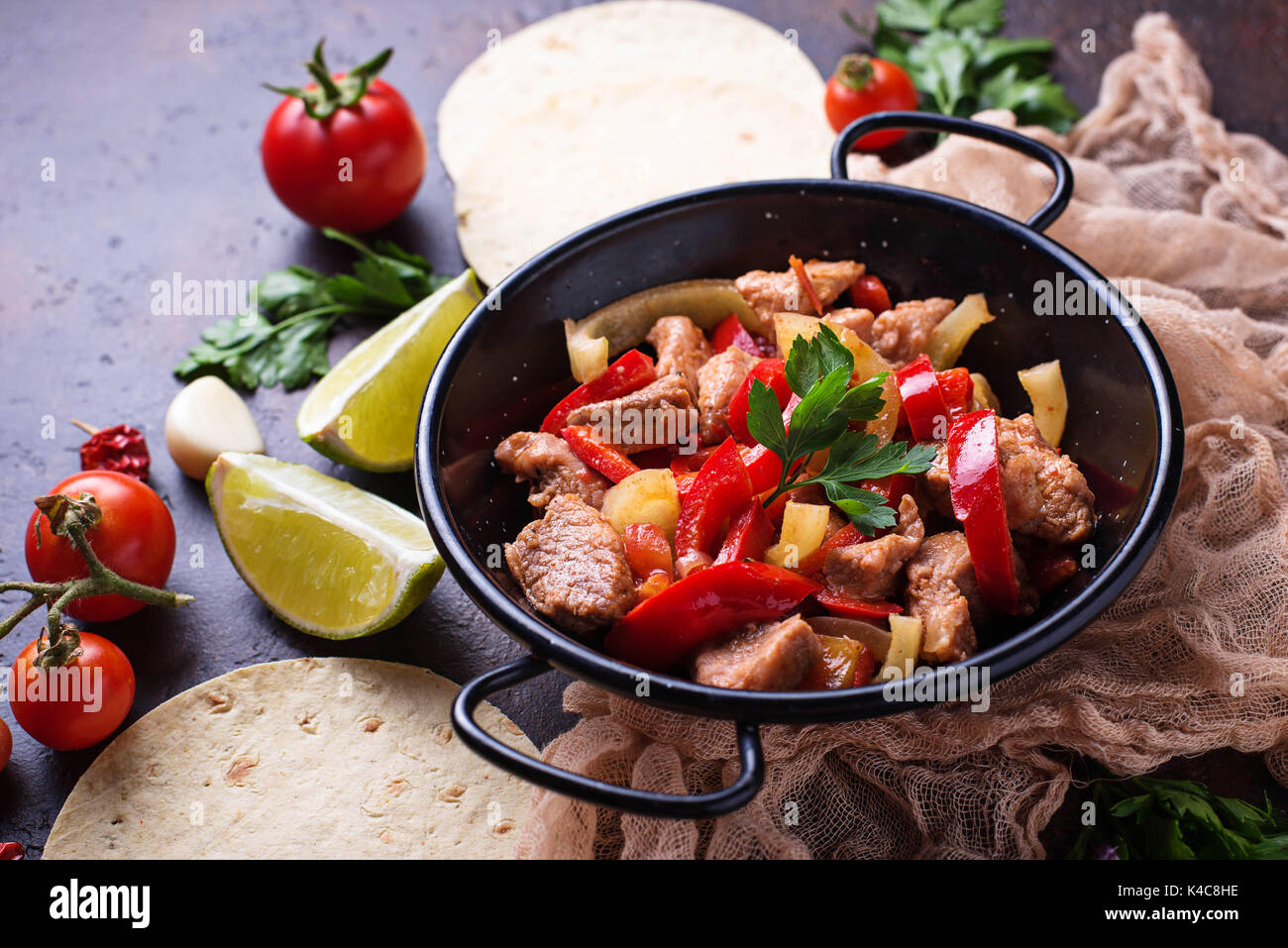 Fajitas with peppers for cooking Mexican tacos. Selective focus Stock