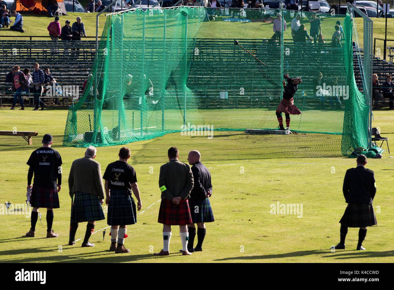 Braemar, Scotland, UK. 02 Sep, 2017: Athletes competing at the 22lb Hammer Throw event during the 2017 Braemar Highland Games. Stock Photo