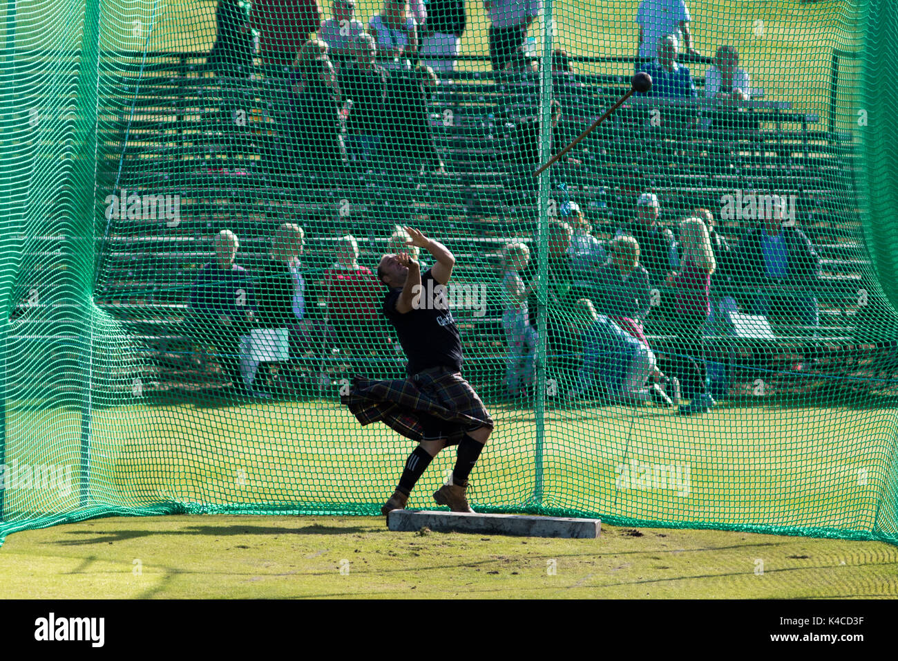 Braemar, Scotland, UK. 02 Sep, 2017: Athletes competing at the 22lb Hammer Throw event during the 2017 Braemar Highland Games. Stock Photo