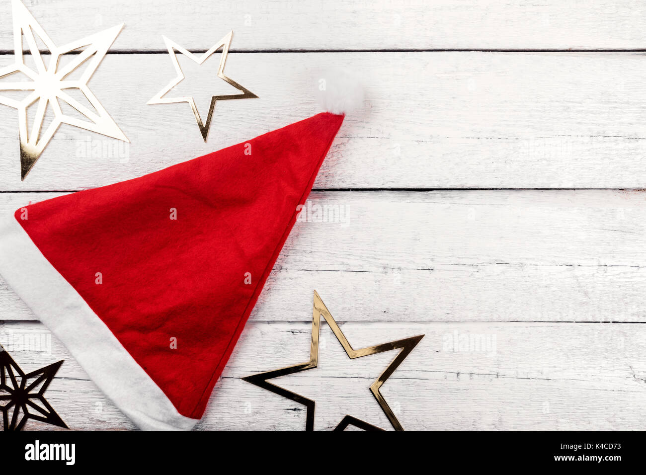 christmas background - santa hat and stars with copy space Stock Photo