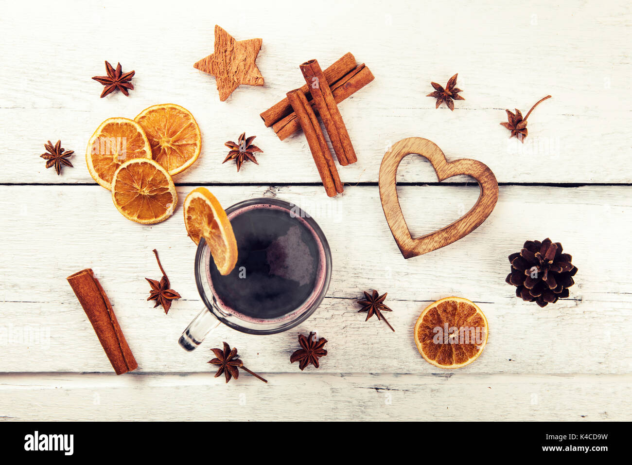 mulled wine with spices and decorations on white wooden table. top view Stock Photo