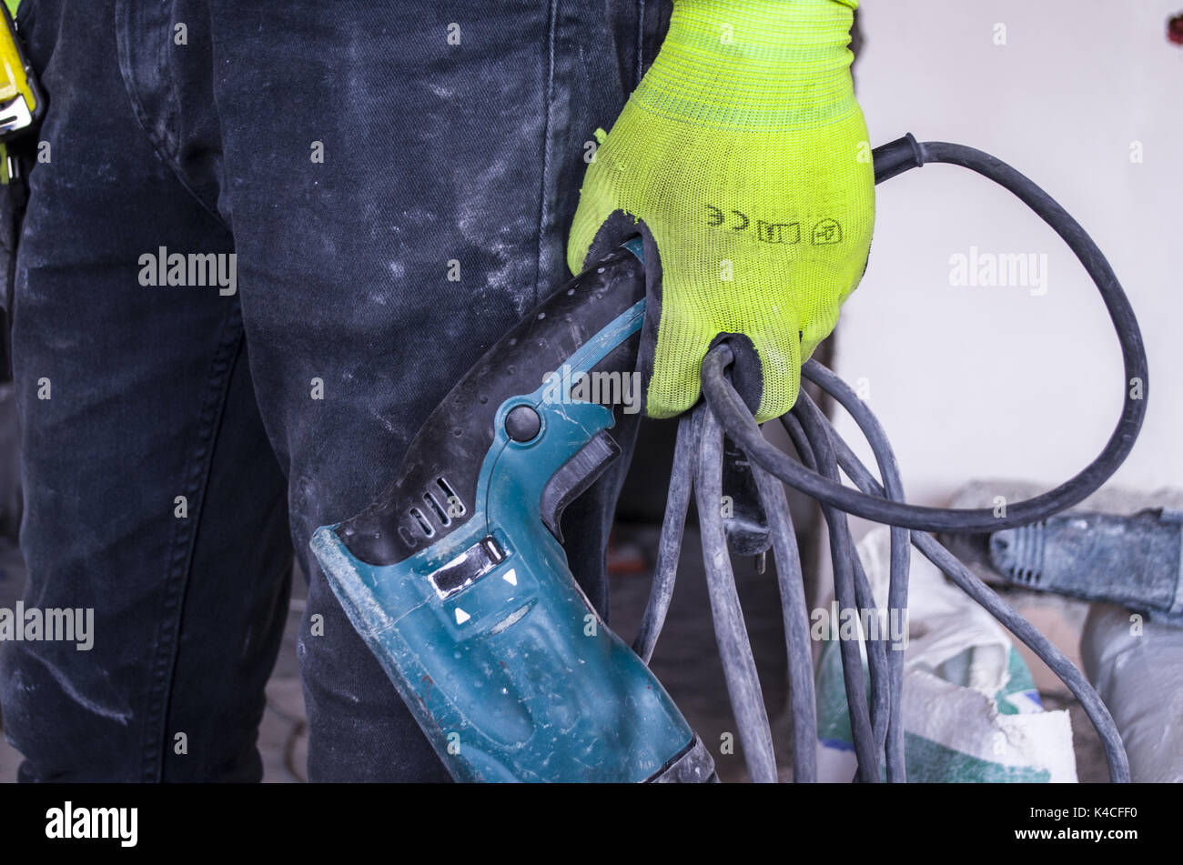 A worker and a drill Stock Photo