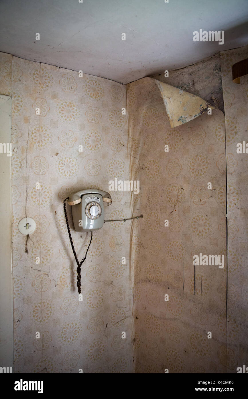 Old Room With Wall Analog Rotary Phone Stock Photo