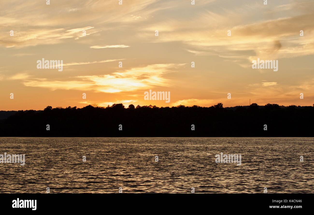 Isolated photo of an amazing sunset on a lake Stock Photo - Alamy
