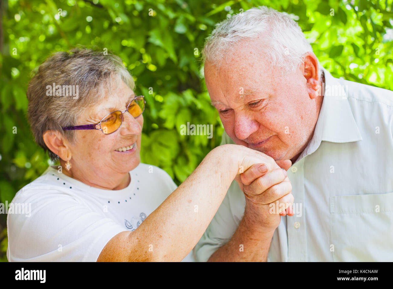 Happy elderly couple in love in the park on a summer day Stock Photo ...