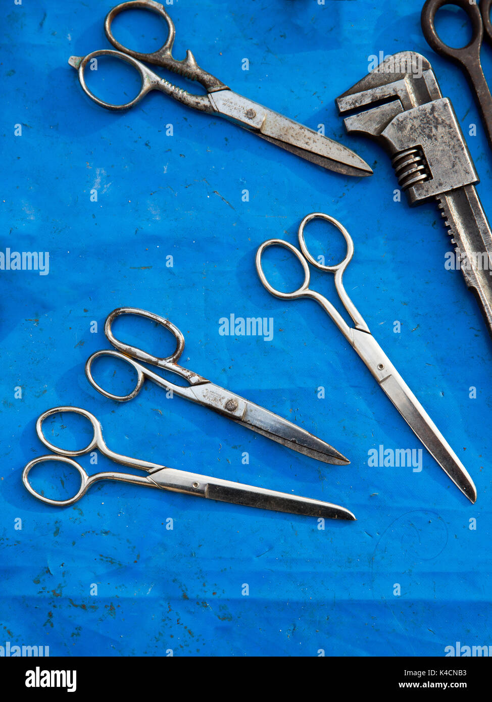 Scissors And Tools On Blue Cloth Stock Photo