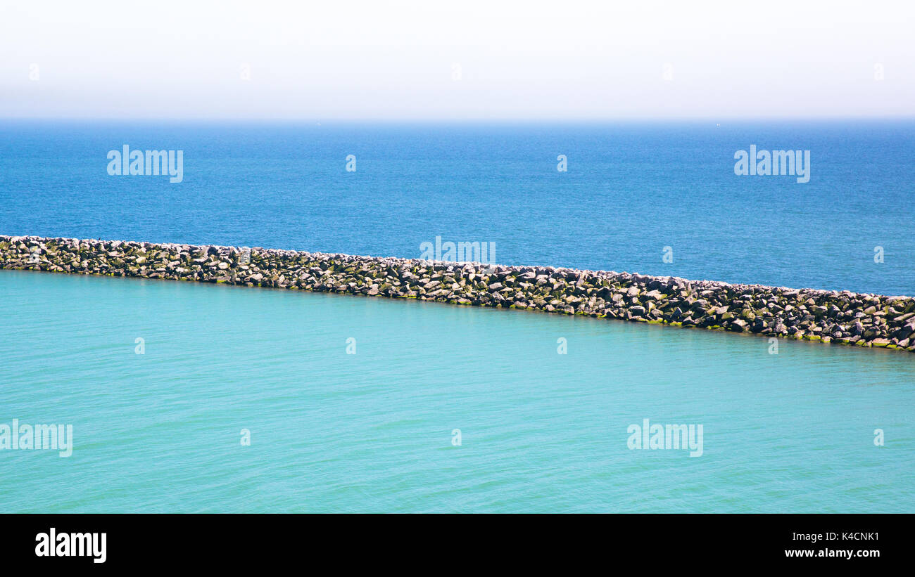 Blue Sea, Harbor Basin And Pier Stock Photo
