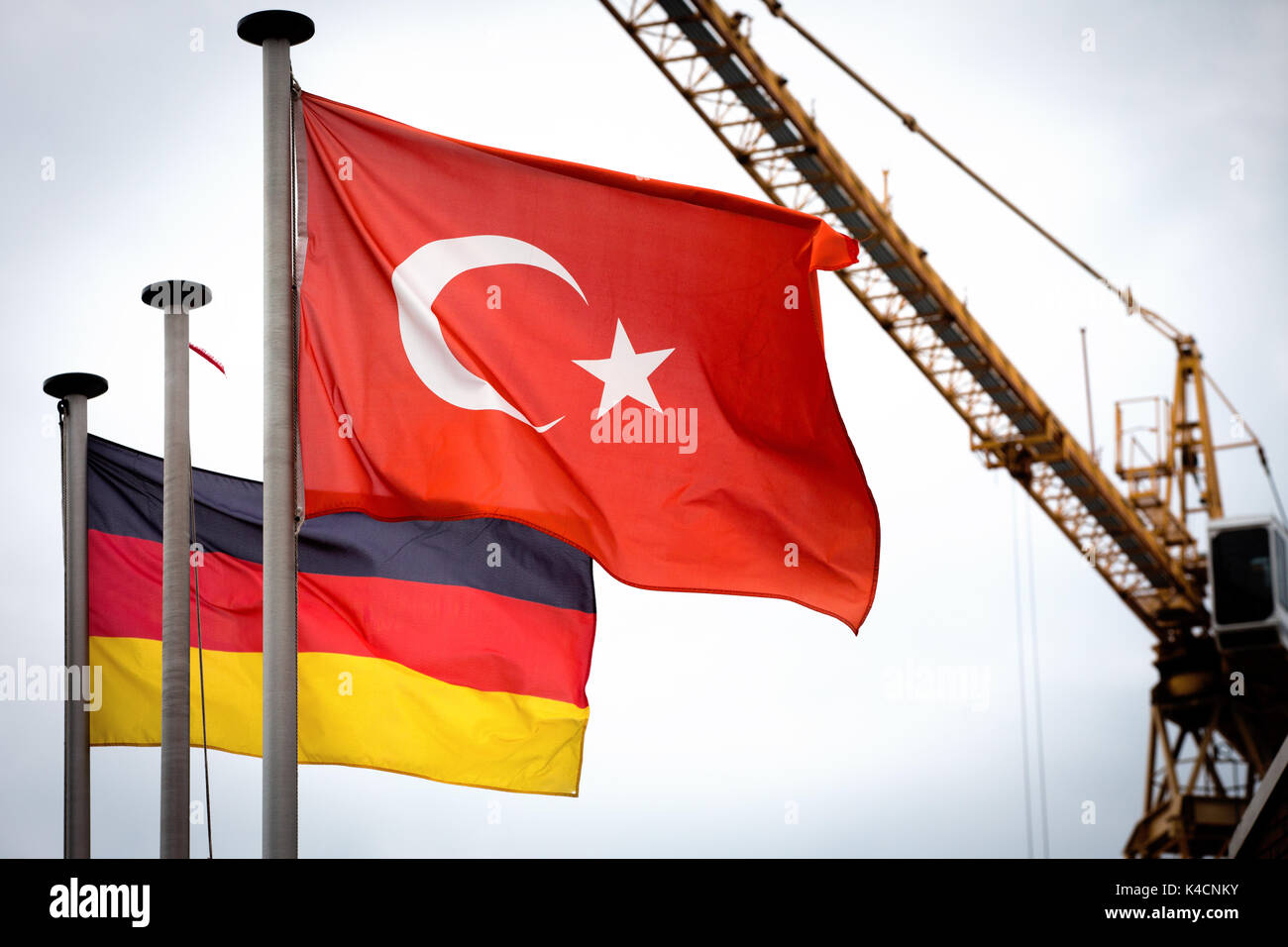 German And Turkish National Flag Next To Each Other, Construction Site Stock Photo