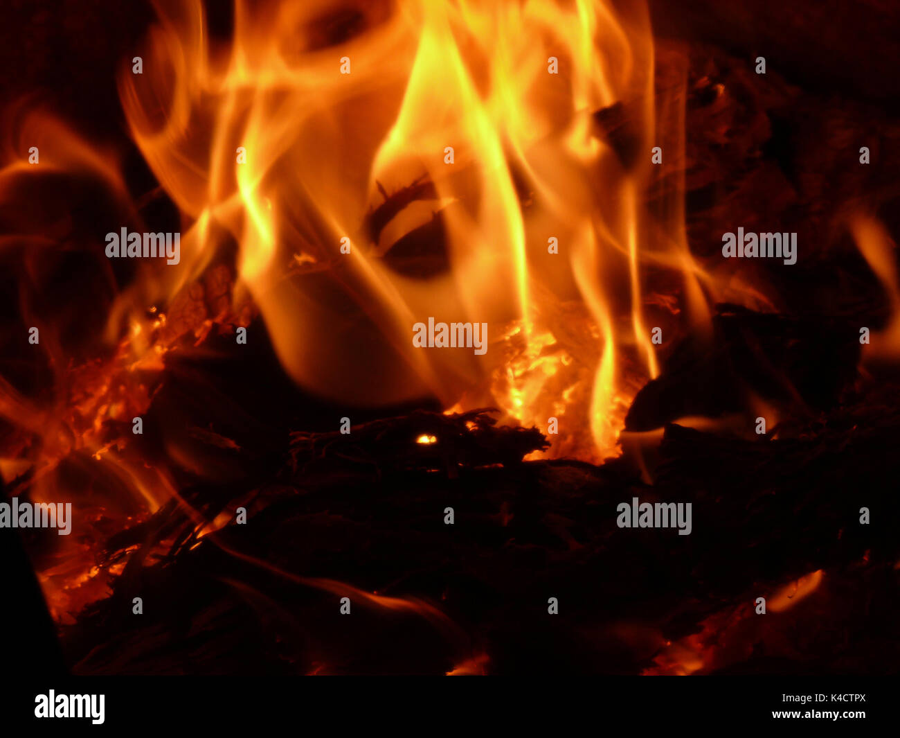 Grimace In Fire, Burning Wood And Flames Look Like A Face Stock Photo -  Alamy