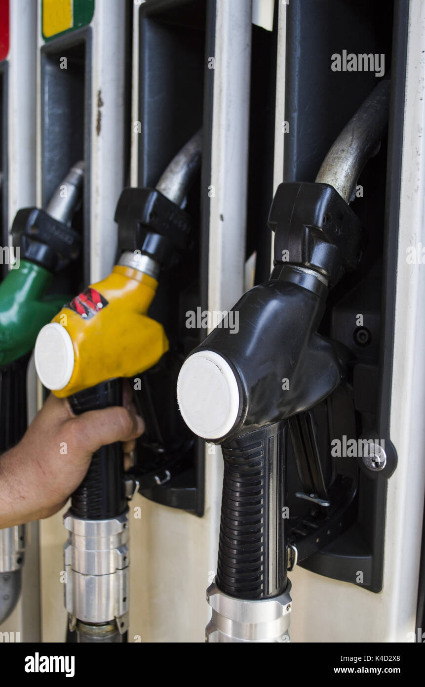 Different types of fuel pumps identified with colors Stock Photo