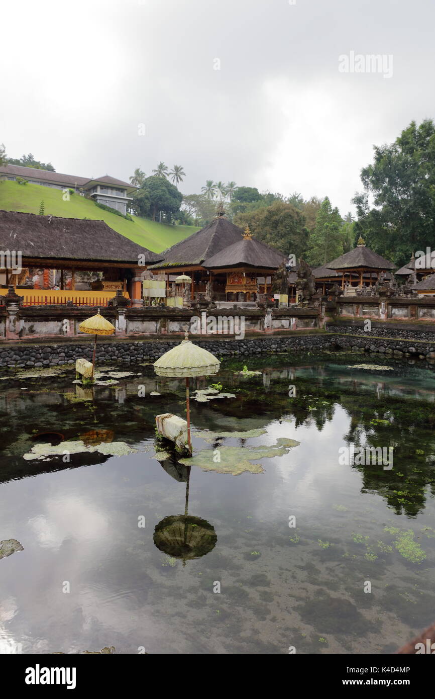 Pura Tirta Empul, is a sacred Hindu water temple located near the town of Tampaksiring in central Bali, Indonesia. Stock Photo