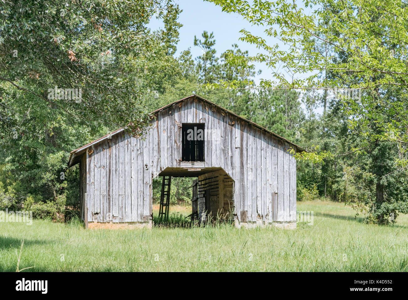 Old wooden barn on a farm in central Alabama, USA. Stock Photo
