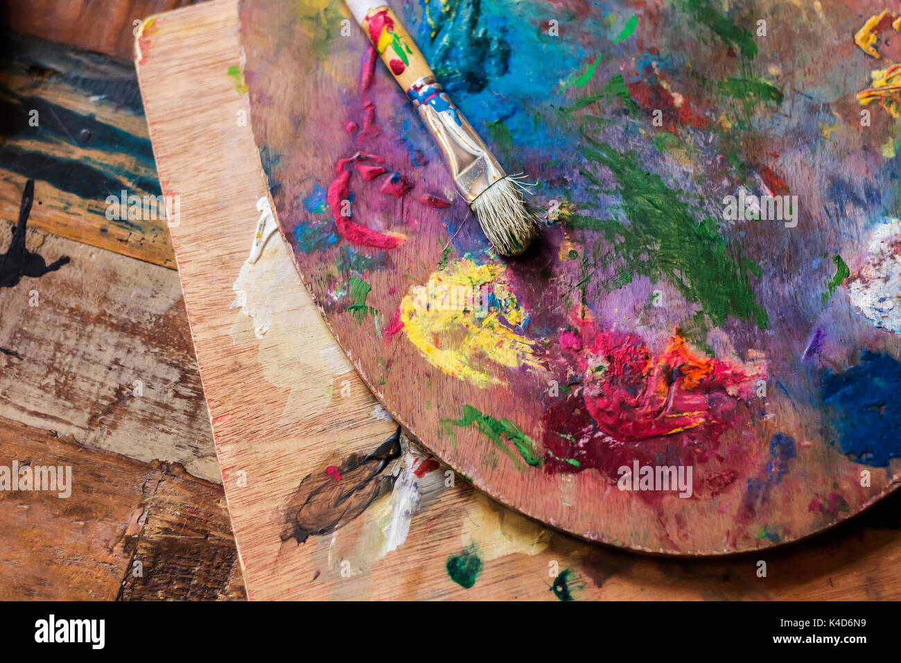 Used Artist Paint Brush And Palette Of Colorful Oil Paint On