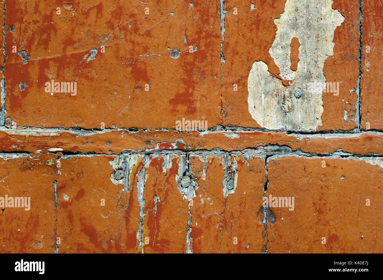 Texture of old dilapidated wooden floor with brown peeling paint. Exfoliated Paint on an Old Wooden Floor. Shabby Background Stock Photo