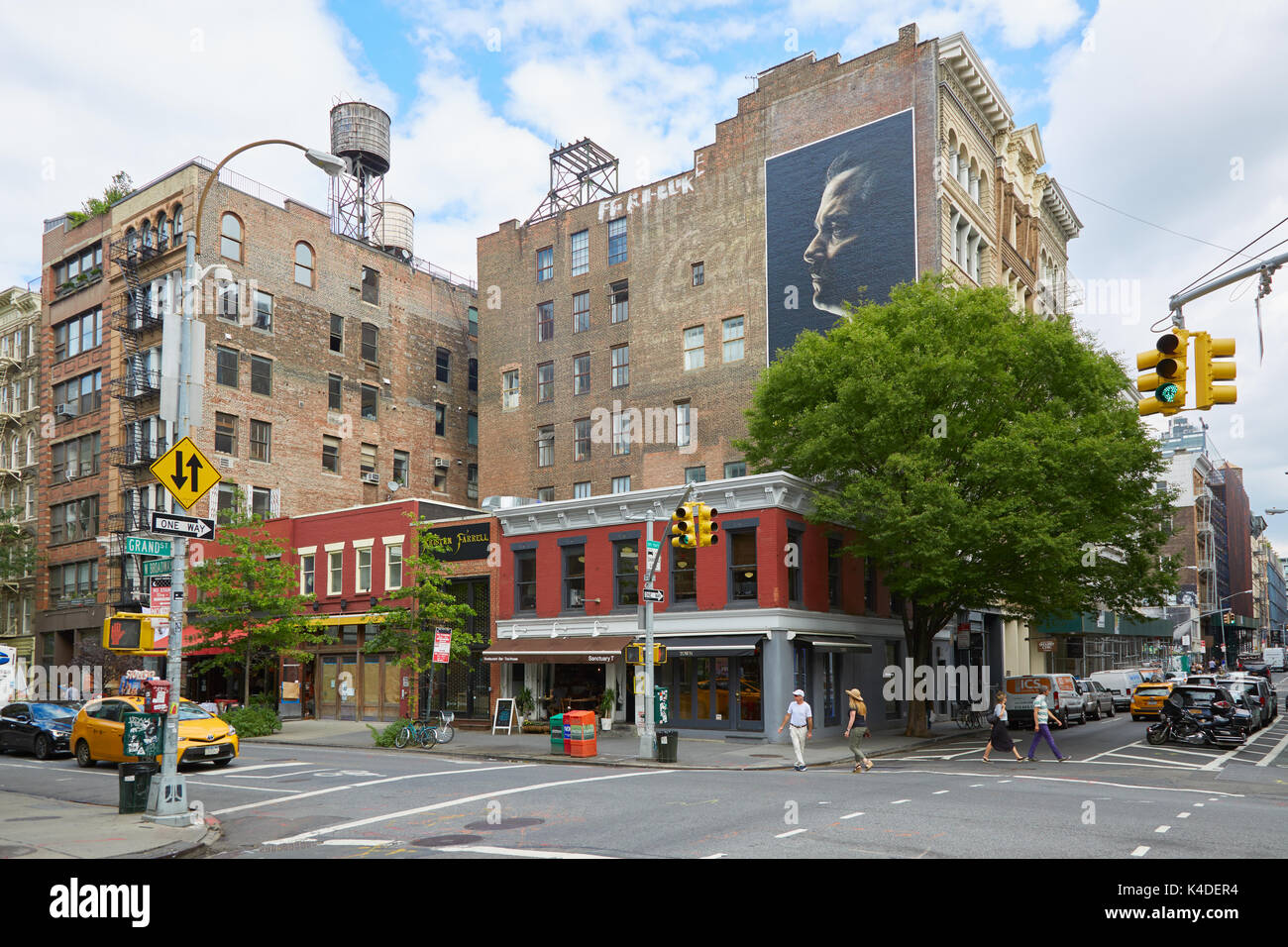 Grand Street in Soho district with people in a cloudy morning in New York Stock Photo