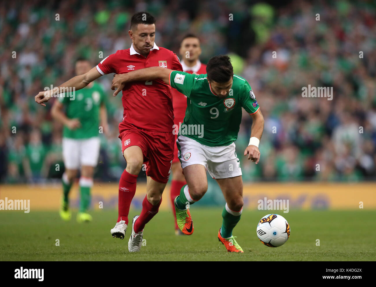 Republic of Ireland's Shane Long and Serbia's Antonio Rukavina battle for the ball during the 2018 FIFA World Cup Qualifying, Group D match at the Aviva Stadium, Dublin. Stock Photo